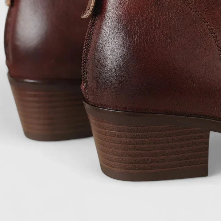 Women's faux leather side zip ankle boots with pointed toe and v-cut shaft