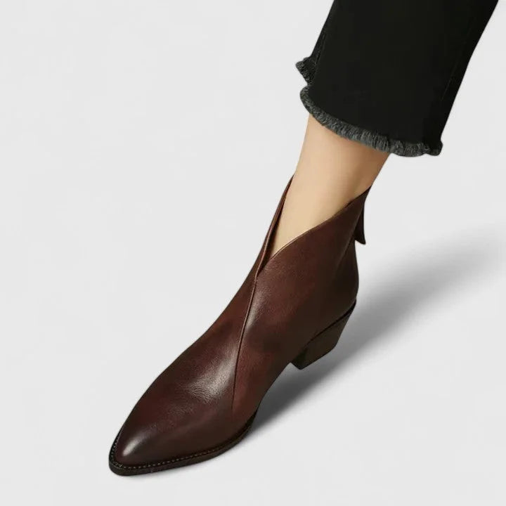 Women's faux leather side zip ankle boots with pointed toe and v-cut shaft