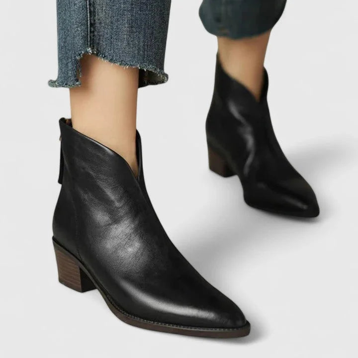 Women's faux leather side zip ankle boots with pointed toe and v-cut shaft