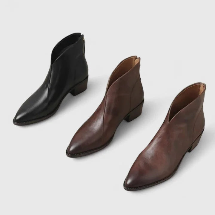 Women's faux leather side zip ankle boots with pointed toe and v-cut shaft