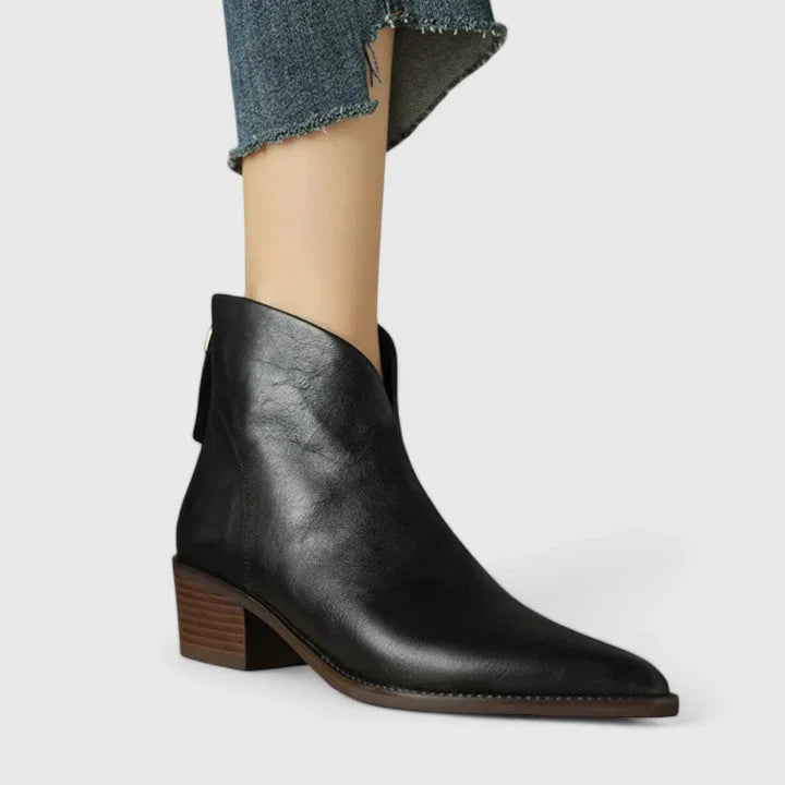 Women's faux leather side zip ankle boots with pointed toe and v-cut shaft