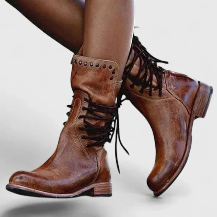 Women's faux leather lace-up combat boots with studded cuff