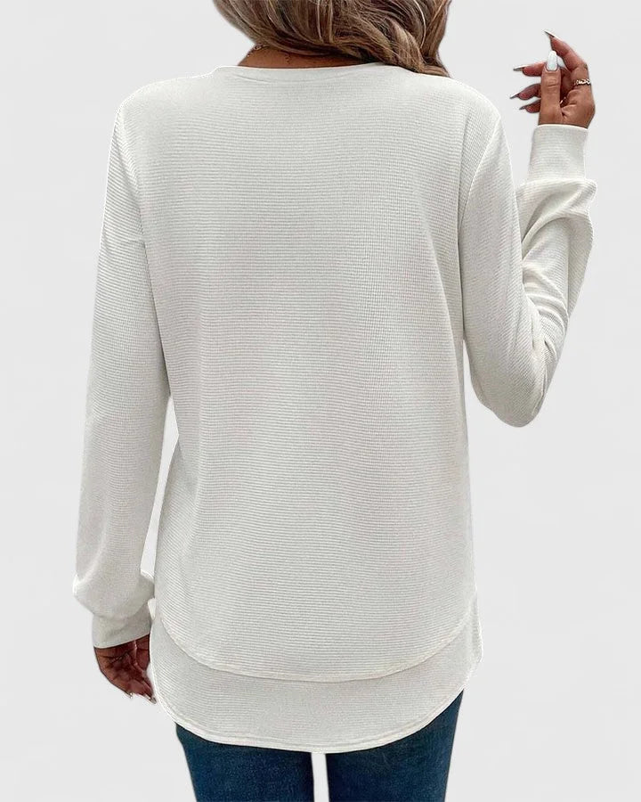 Women's knit crew neck sweater with curved hem