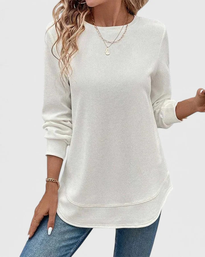 Women's knit crew neck sweater with curved hem