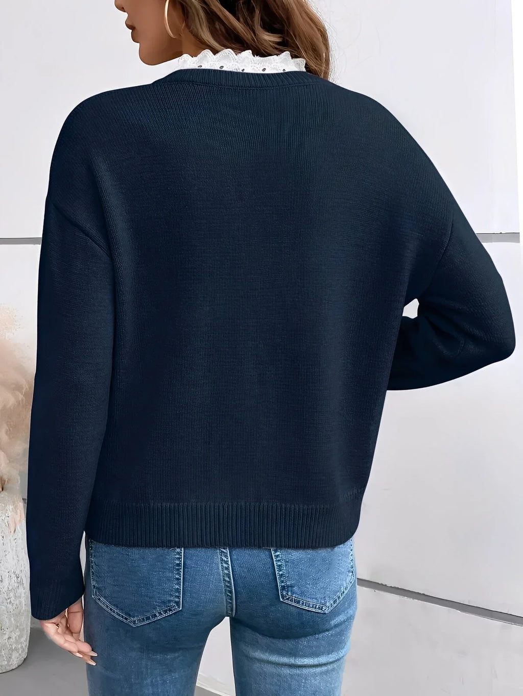 Women's knit v-neck sweater with ruffled trim
