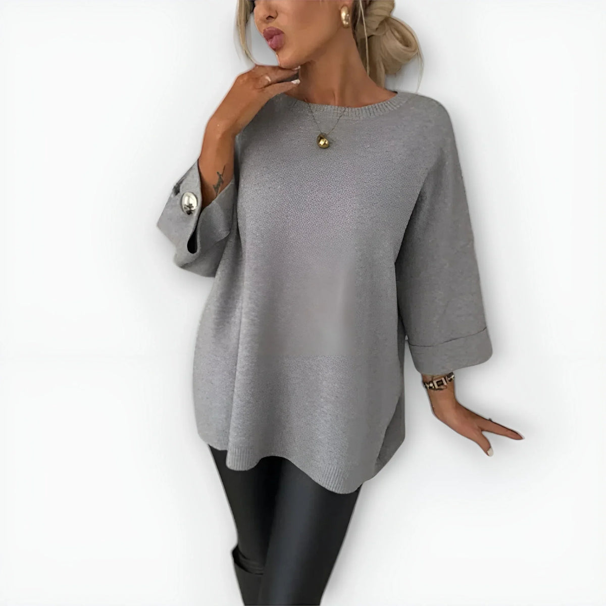 Women's knit crew neck sweater with buttoned cuffs