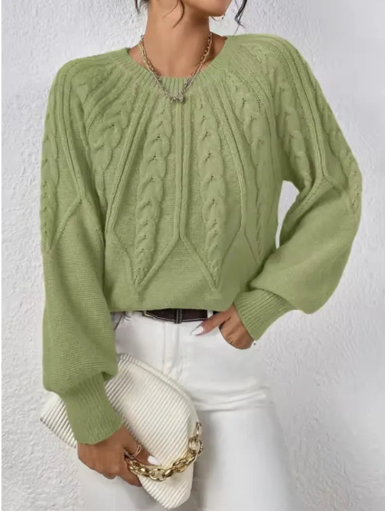 Women's crew neck cable knit sweater with varied pattern