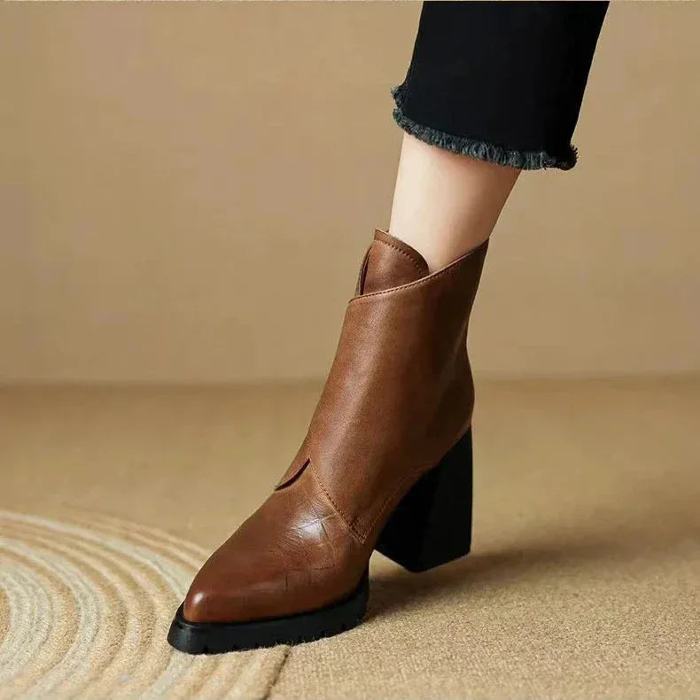 Women's faux leather ankle boots with metallic buckle detail