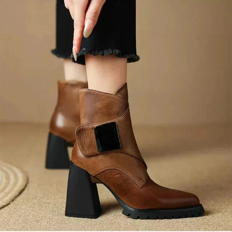 Women's faux leather ankle boots with metallic buckle detail