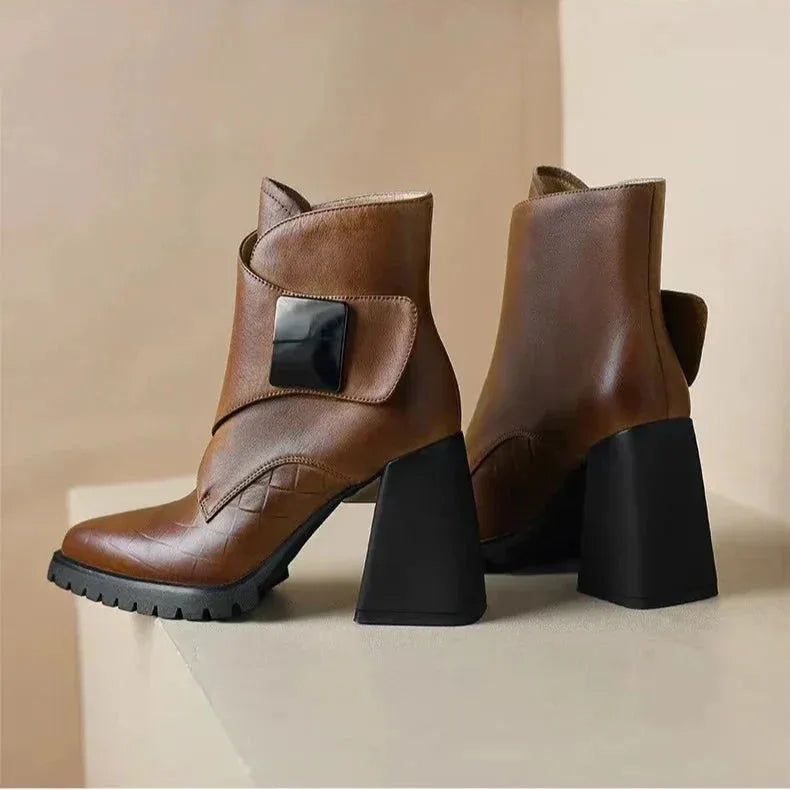 Women's faux leather ankle boots with metallic buckle detail
