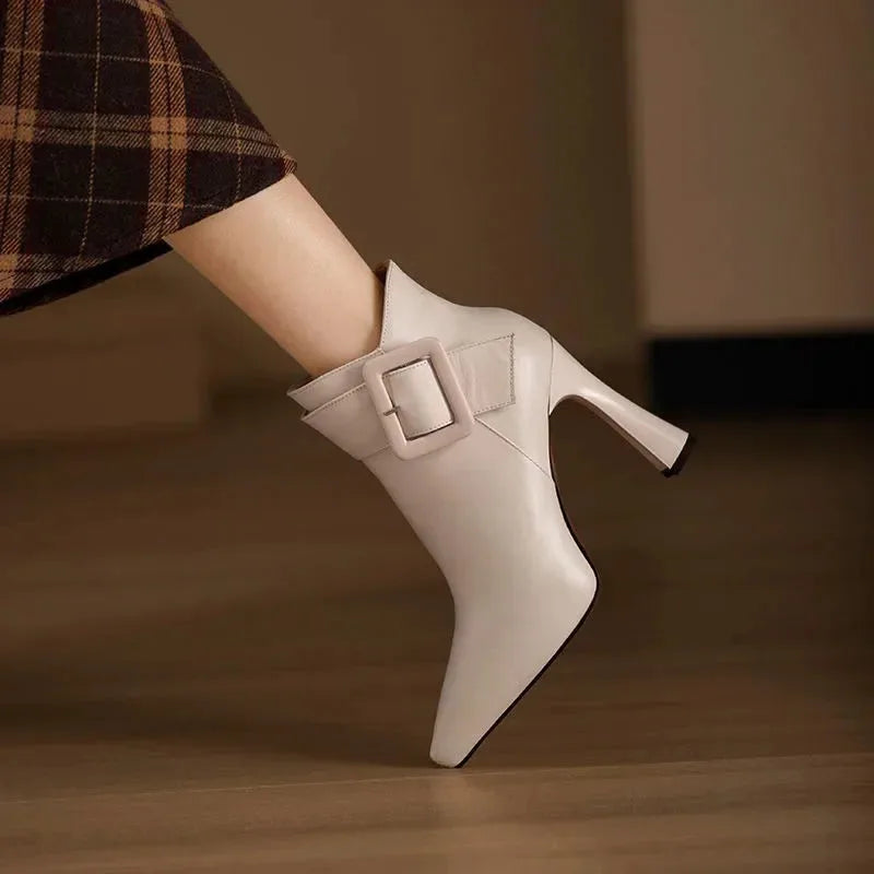 Women's faux leather side zip ankle boots with large buckle