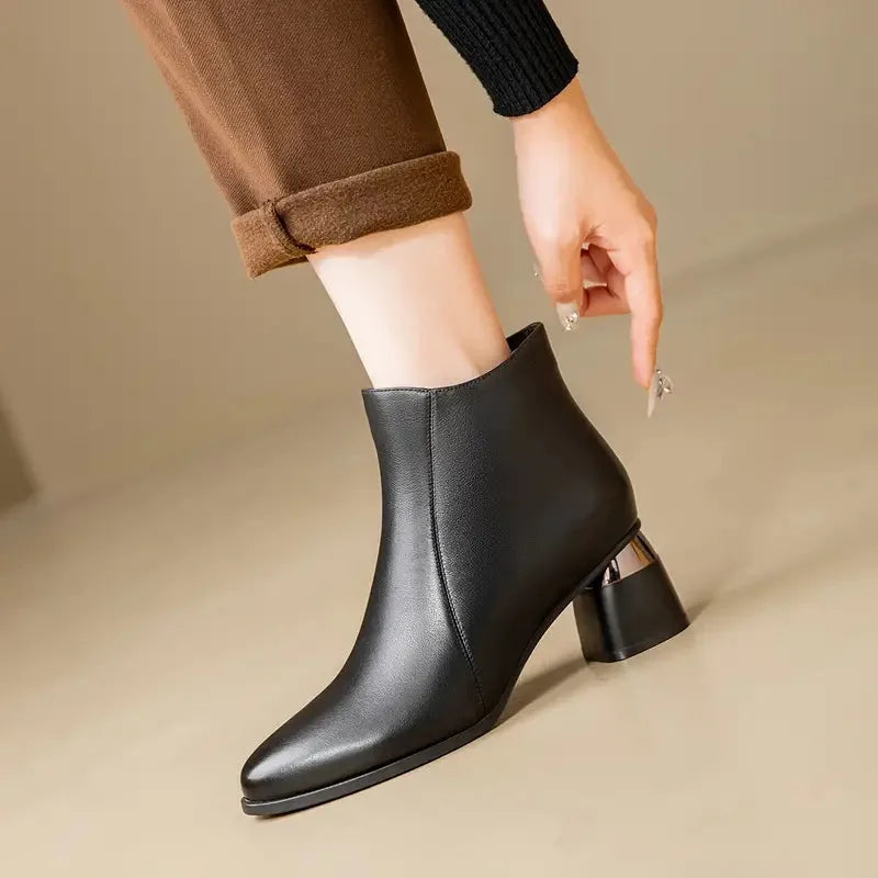 Women's faux leather side zip ankle boots with pointed toe and metallic heel