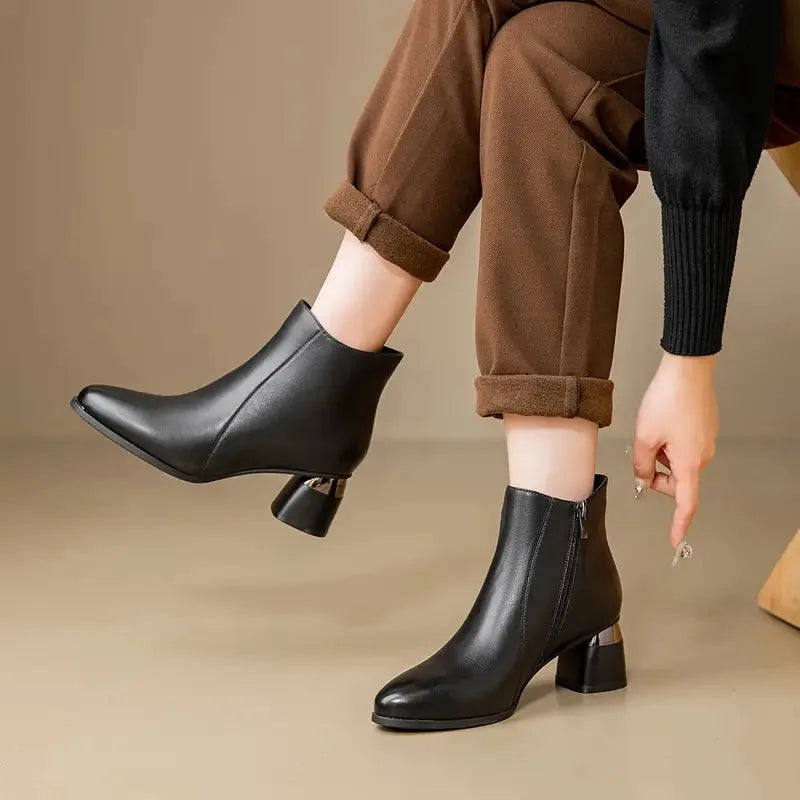 Women's faux leather side zip ankle boots with pointed toe and metallic heel