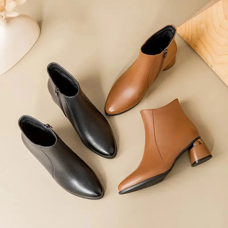 Women's faux leather side zip ankle boots with pointed toe and metallic heel