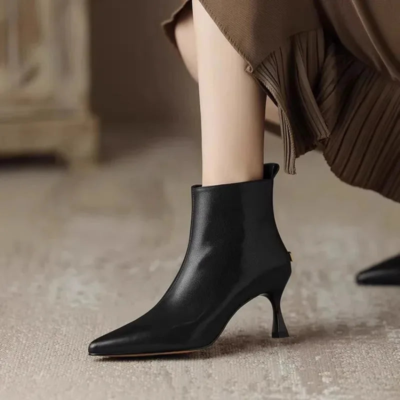 Women's faux leather side zip ankle boots with 'uim' lettering