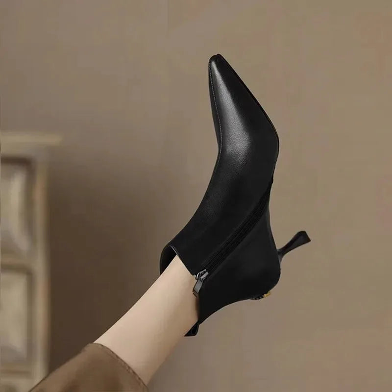 Women's faux leather side zip ankle boots with 'uim' lettering