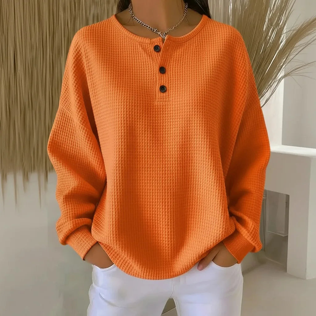 Women's knit crew neck sweater with button placket