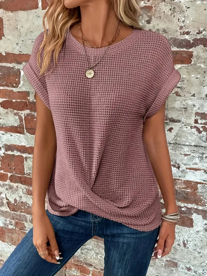 Women's knit crew neck sweater with twisted front hem