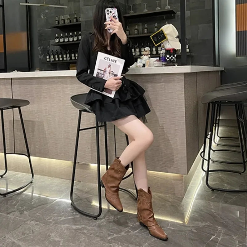 Women's studded faux leather side zip ankle boots