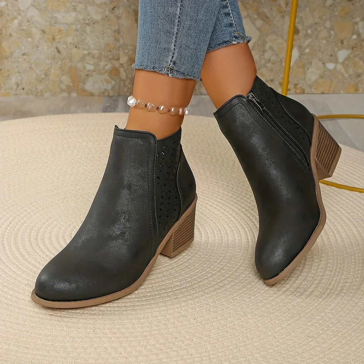 Women's faux leather side zip orthopedic ankle boots with laser-cut perforations