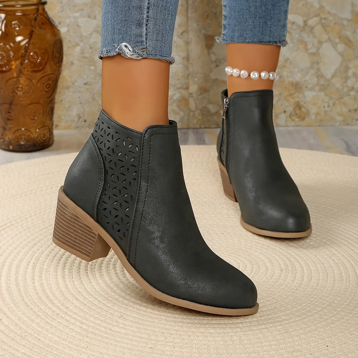 Women's faux leather side zip orthopedic ankle boots with laser-cut perforations