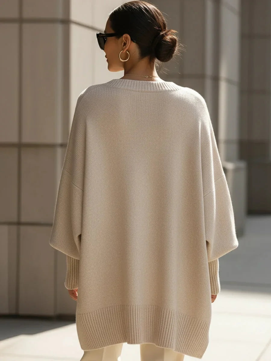 Women's knit crew neck sweater with asymmetrical hem