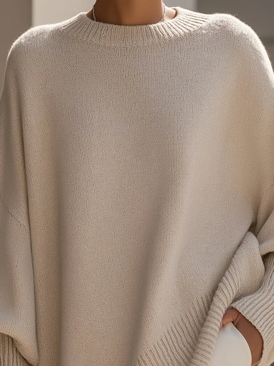 Women's knit crew neck sweater with asymmetrical hem