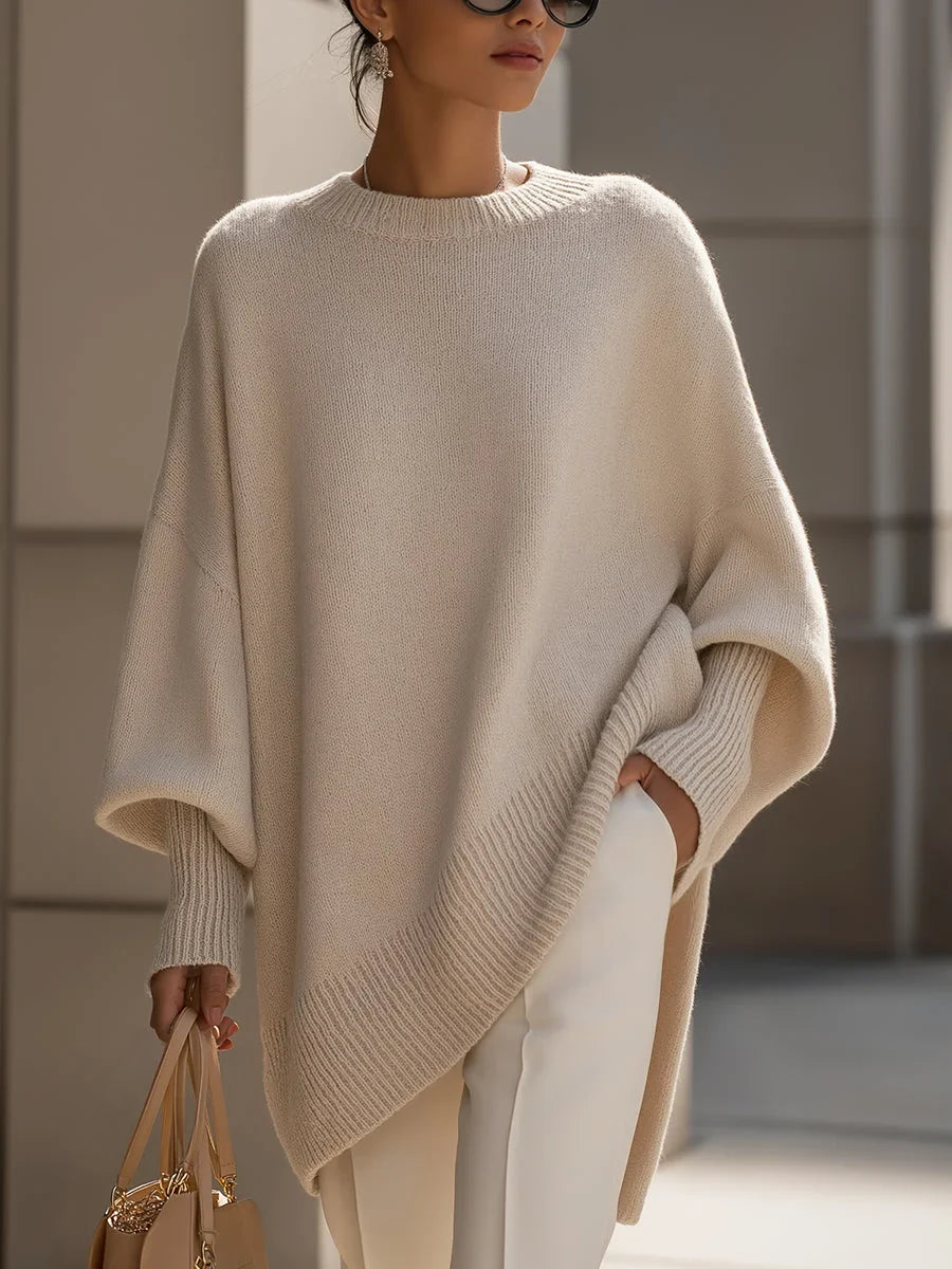 Women's knit crew neck sweater with asymmetrical hem